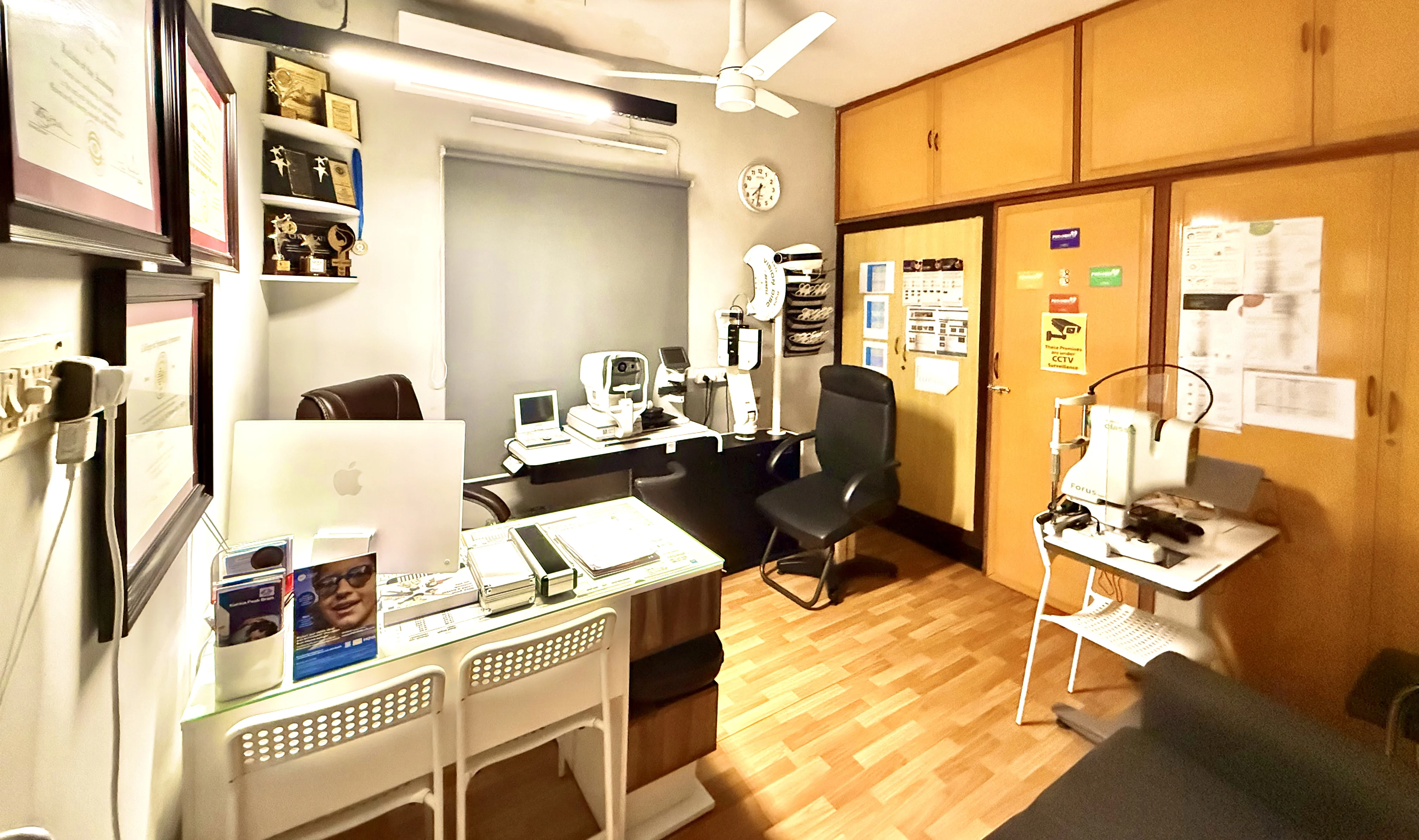 Consultation room with diagnostic equipment at Caring Vision Therapy