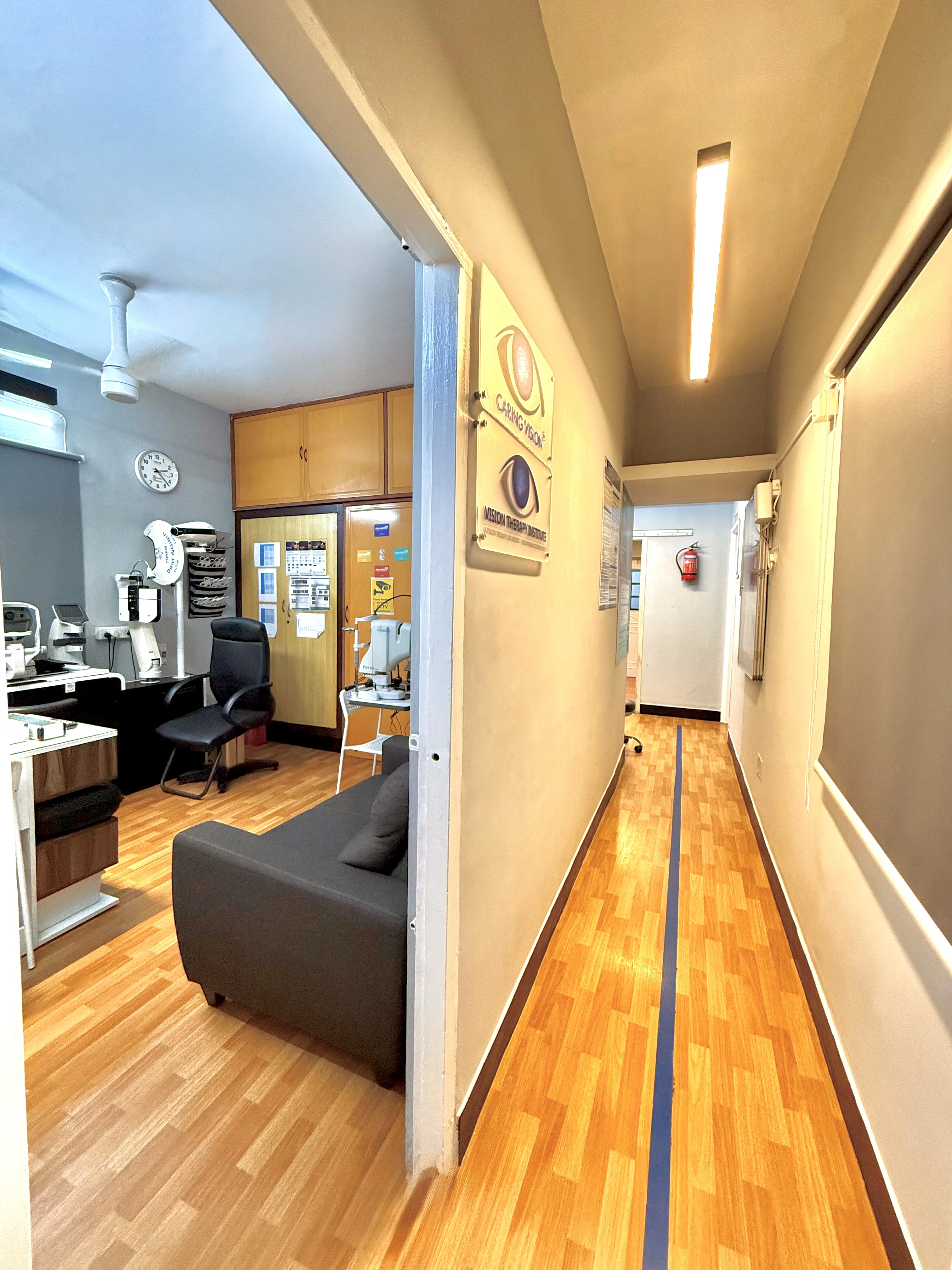 Corridor leading to diagnostic rooms at Caring Vision Therapy