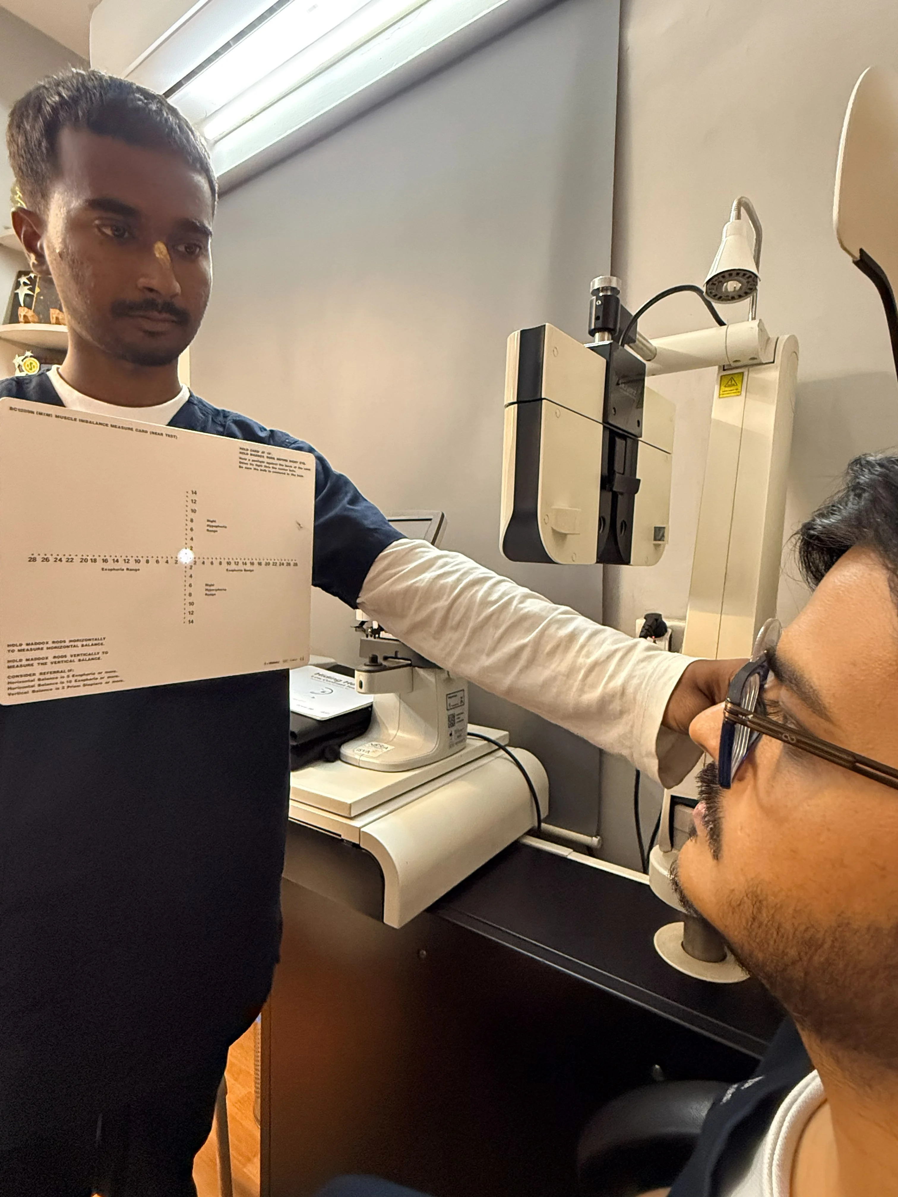 Closeup of clinical vision assessment at Caring Vision Therapy, Chennai