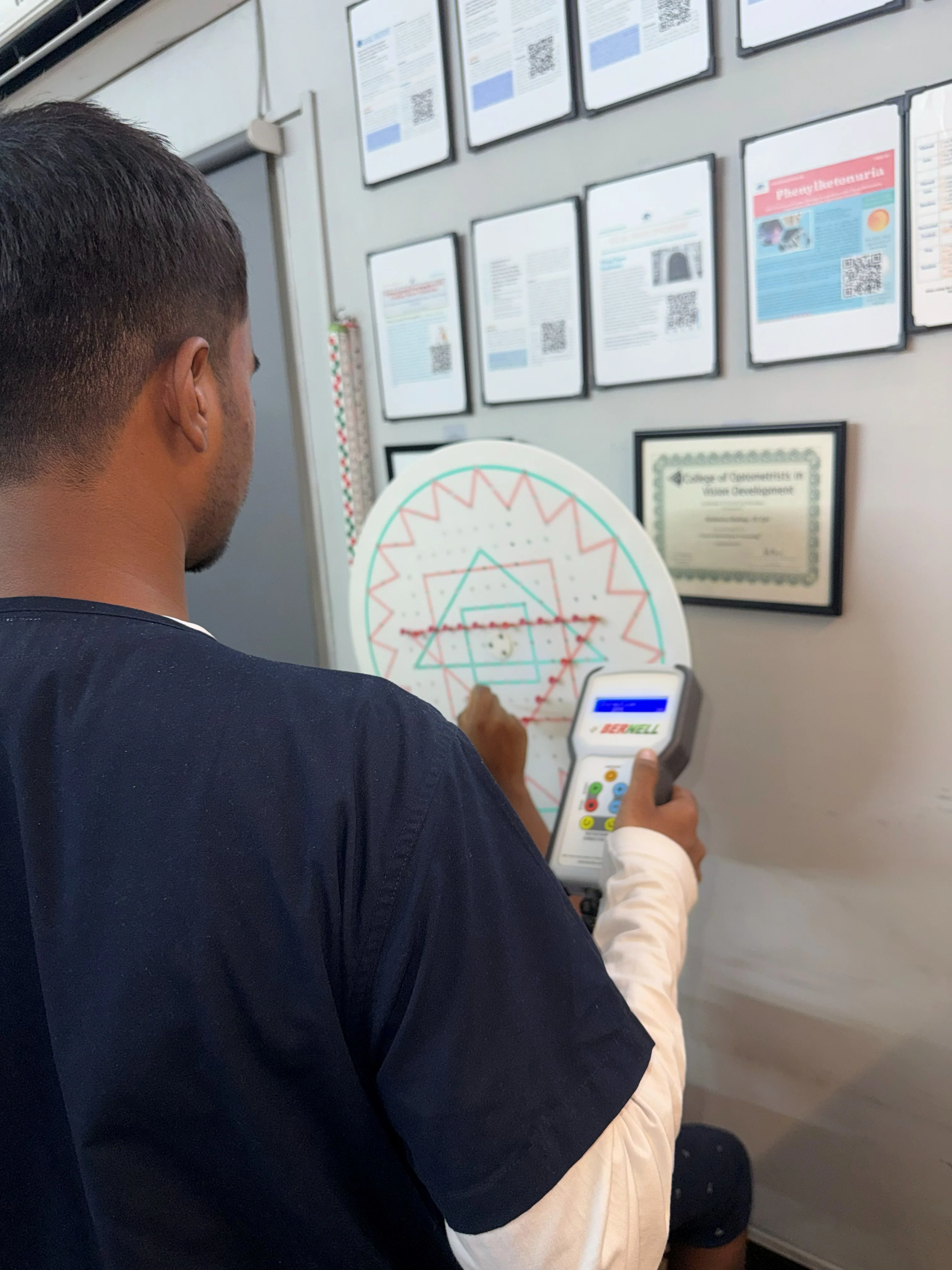 Saccadic wall chart session at Caring Vision Therapy clinic