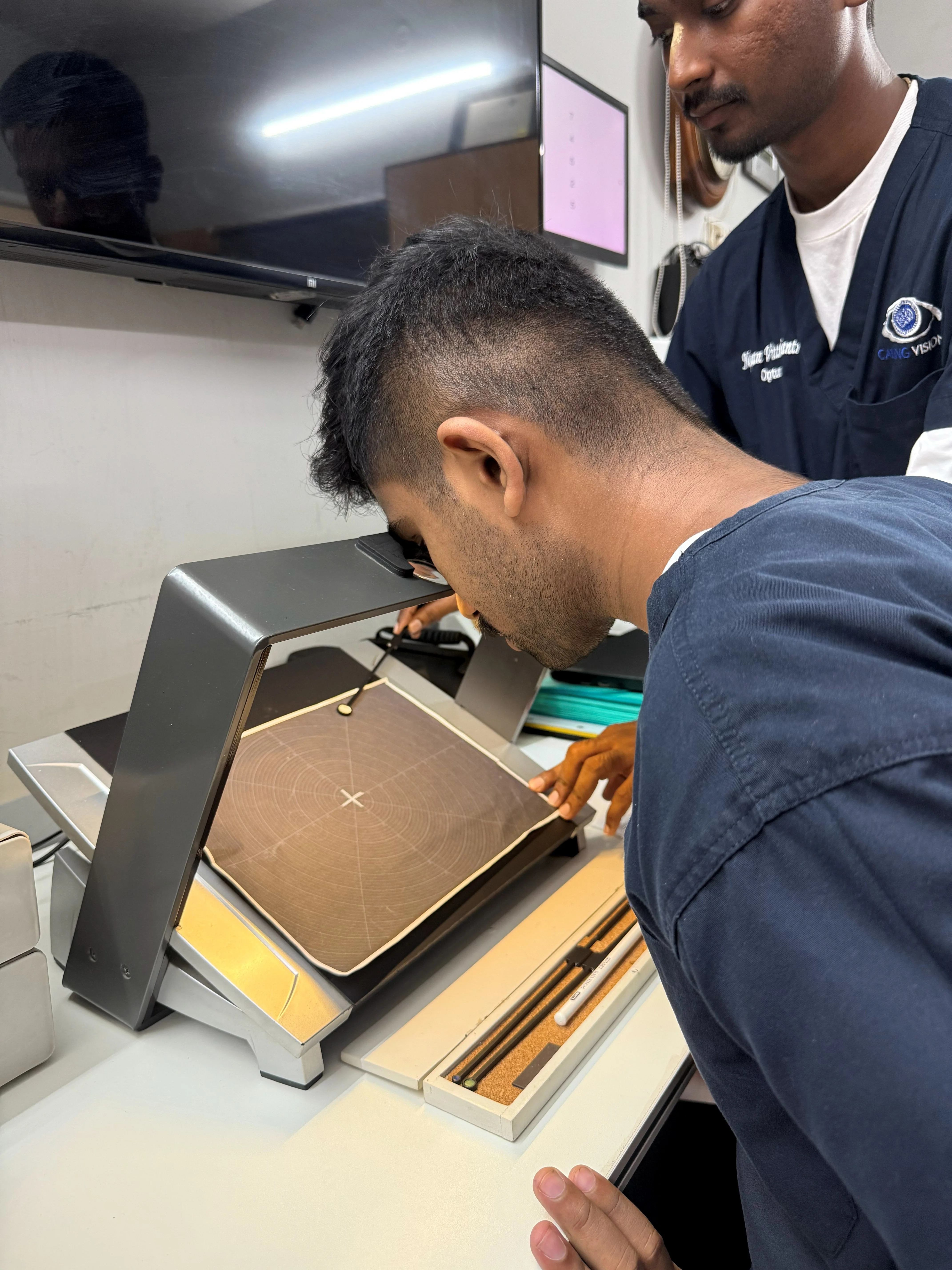 Tabletop hood viewer exercise at Caring Vision Therapy, Ashok Nagar