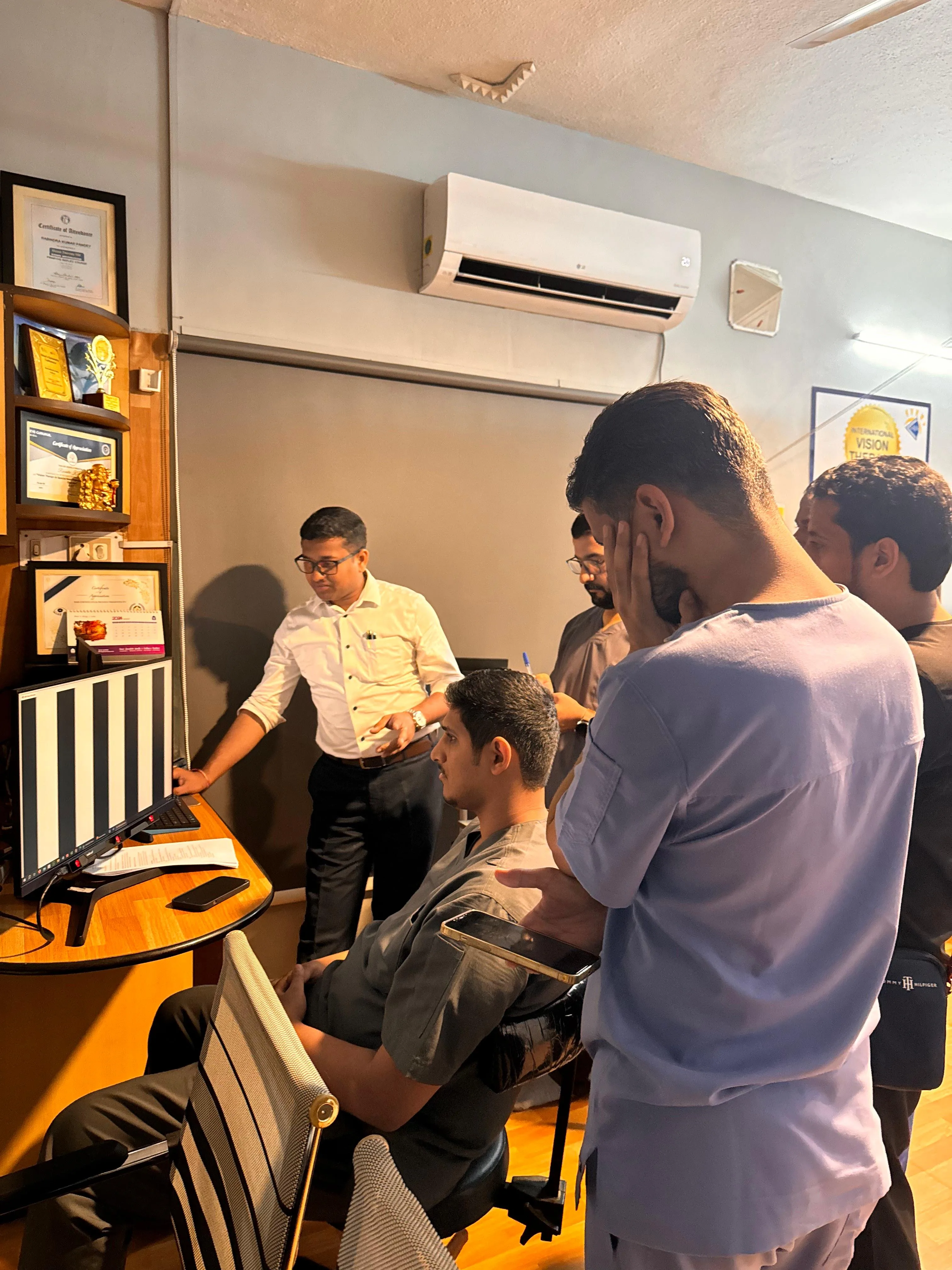 Clinicians in a group case review session during Optometry Training at Vision Therapy Institute